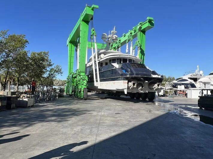 a large boat with a crane on top of it aboard OCTOPUSSY Yacht for Sale
