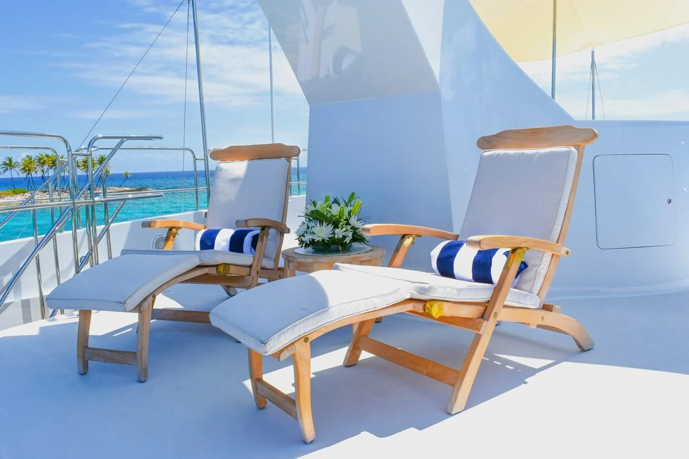 a group of chairs on a deck aboard OCTOPUSSY Yacht for Sale