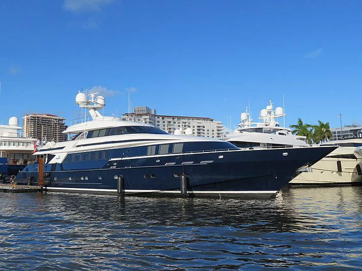 a large boat in a harbor aboard OCTOPUSSY Yacht for Sale