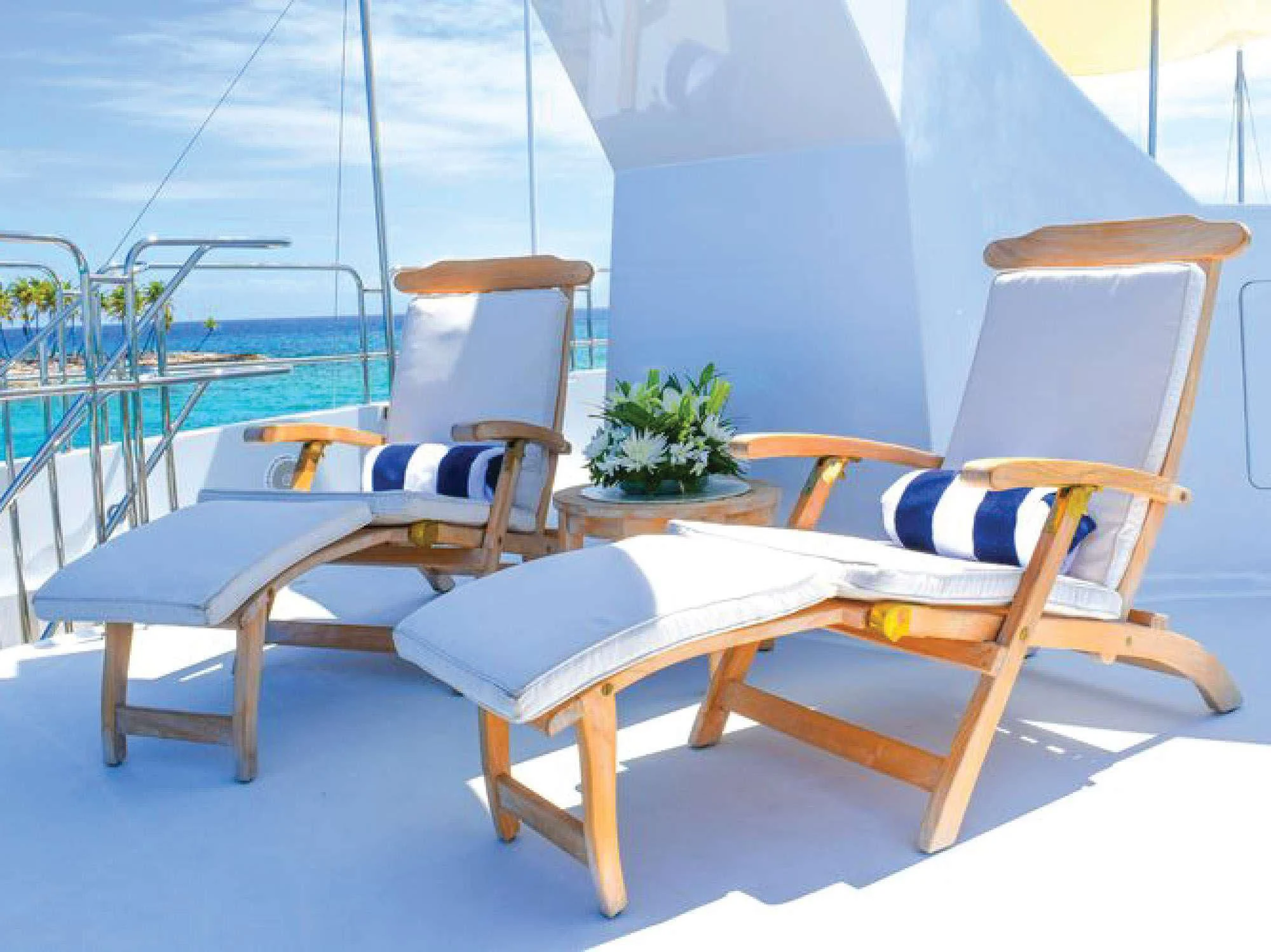 a group of chairs on a boat aboard OCTOPUSSY Yacht for Sale