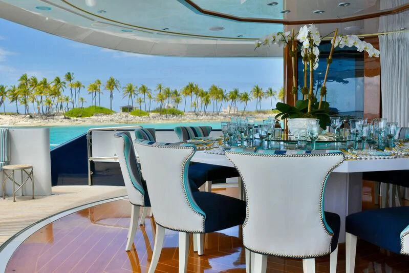 a table and chairs in a room aboard OCTOPUSSY Yacht for Sale