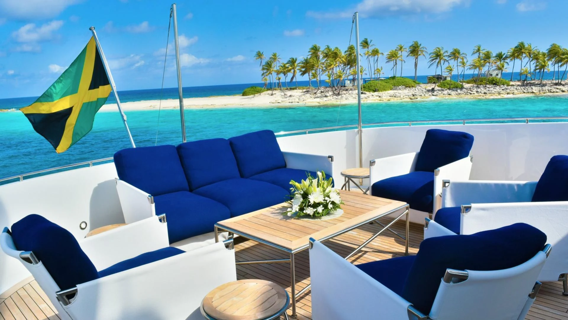 a pool with chairs and tables aboard OCTOPUSSY Yacht for Sale