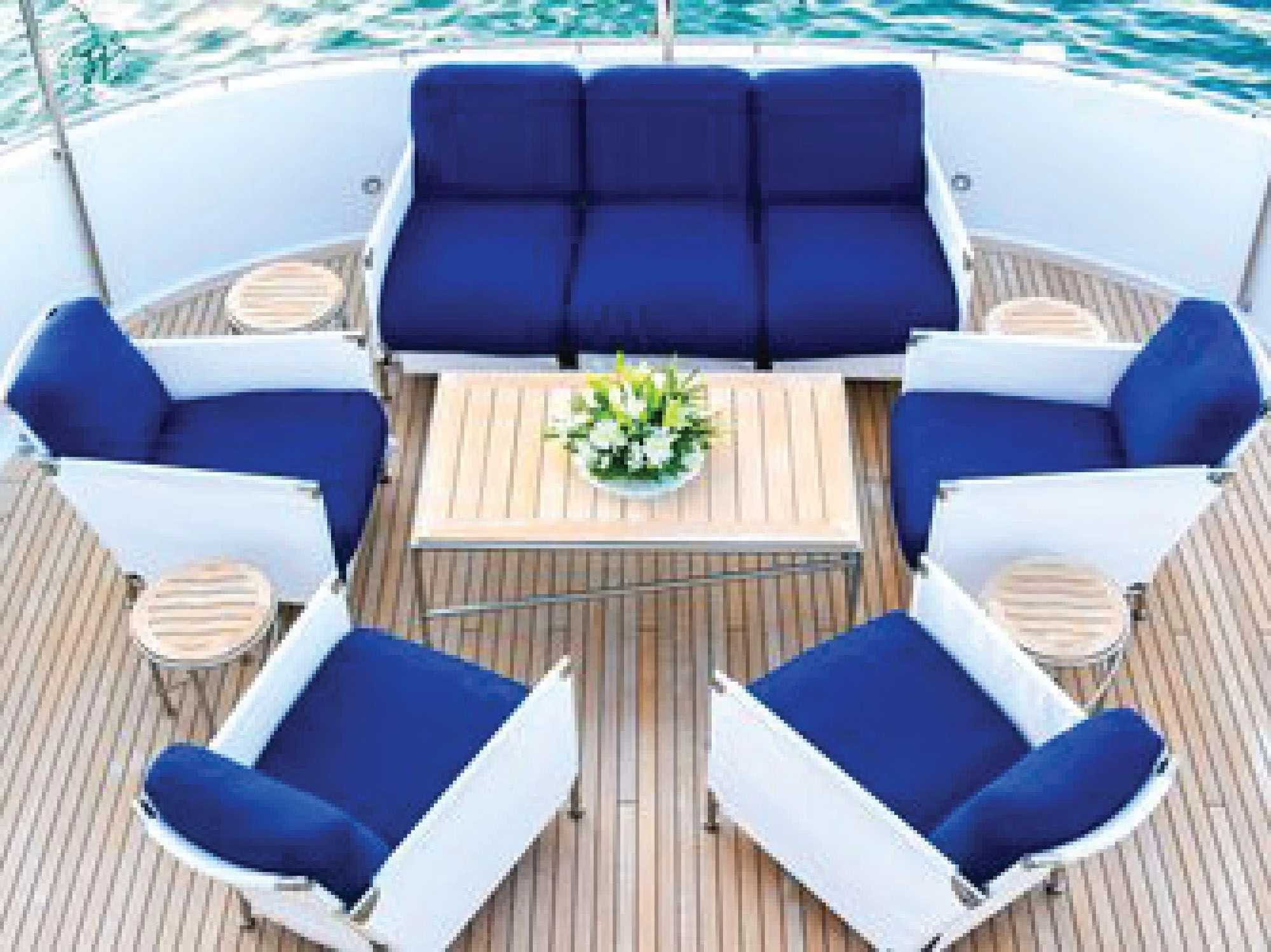 a boat with chairs and tables aboard OCTOPUSSY Yacht for Sale