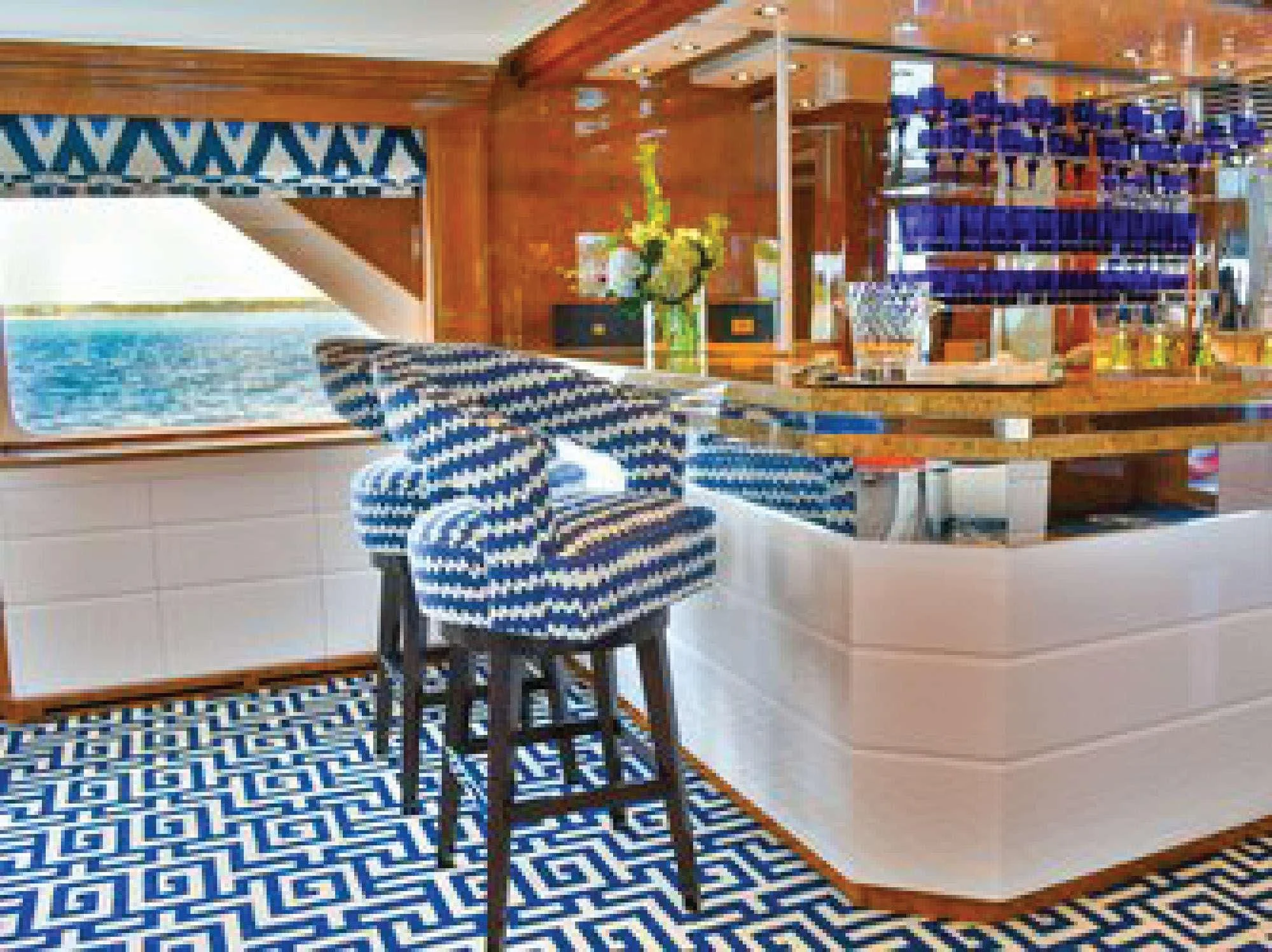 a room with a table and chairs aboard OCTOPUSSY Yacht for Sale