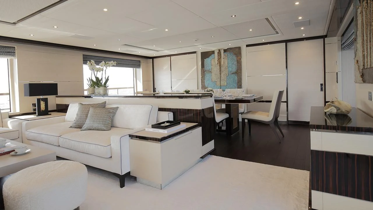 a room with a couch and a table aboard BAMBOO Yacht for Sale