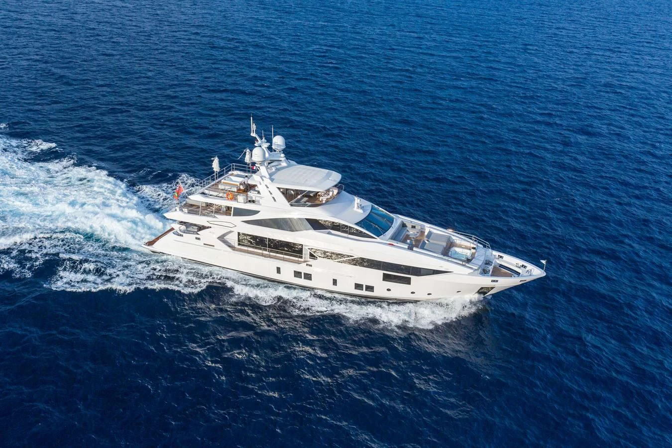 a white yacht on the water aboard BAMBOO Yacht for Sale