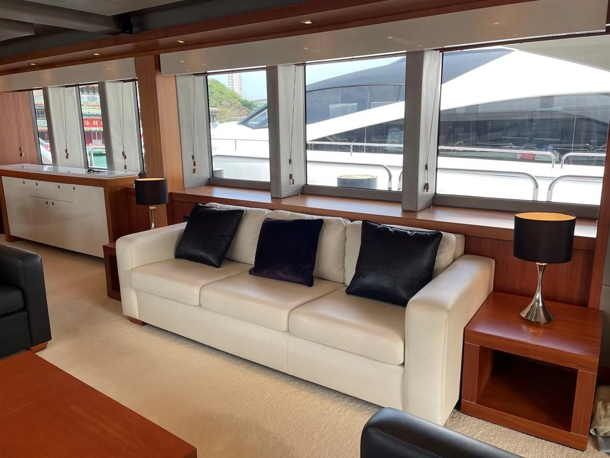 a living room with a large window aboard HARBOUR Yacht for Sale