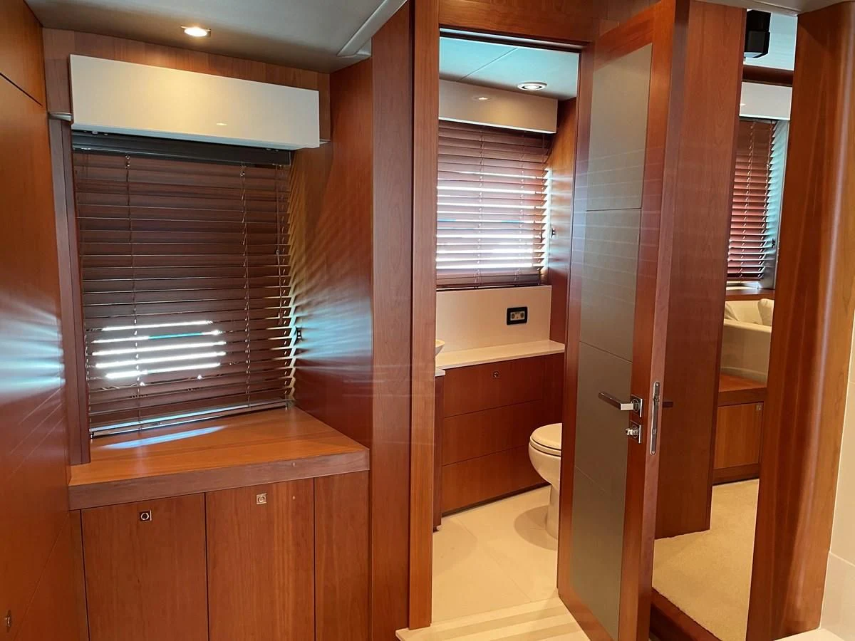 a room with wooden cabinets aboard HARBOUR Yacht for Sale