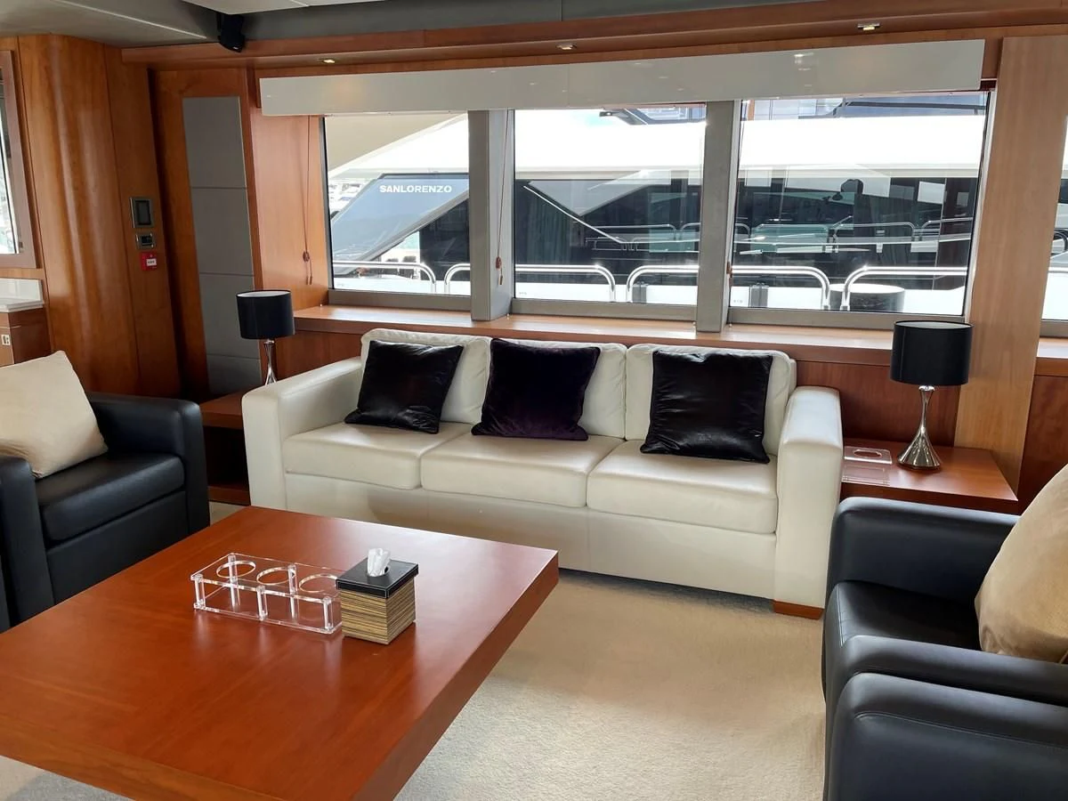 a living room with a couch and a table aboard HARBOUR Yacht for Sale