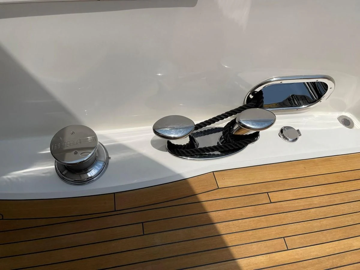 a group of silver coins on a white sink aboard HARBOUR Yacht for Sale