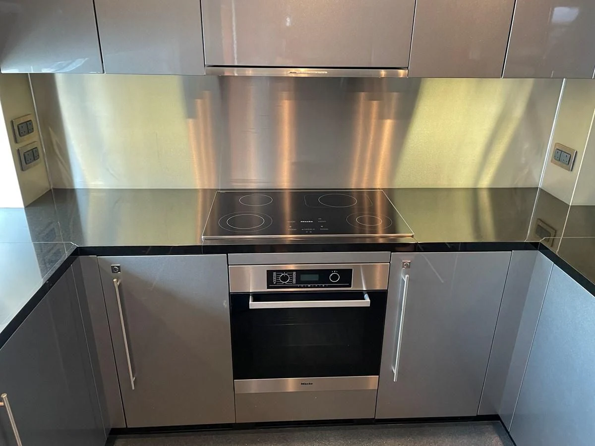 a kitchen with stainless steel appliances aboard HARBOUR Yacht for Sale