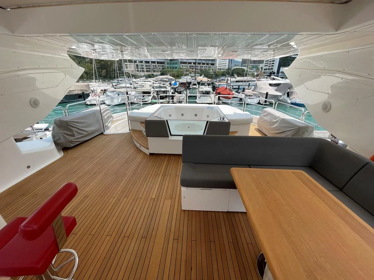 a room with a couch and a table with chairs aboard HARBOUR Yacht for Sale