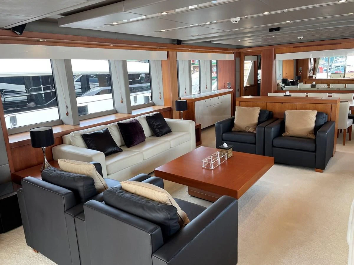 a living room with a couch and a coffee table aboard HARBOUR Yacht for Sale