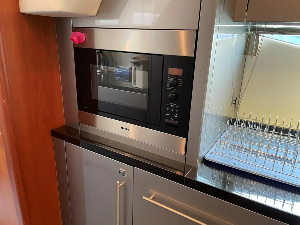 a microwave oven in a kitchen aboard HARBOUR Yacht for Sale
