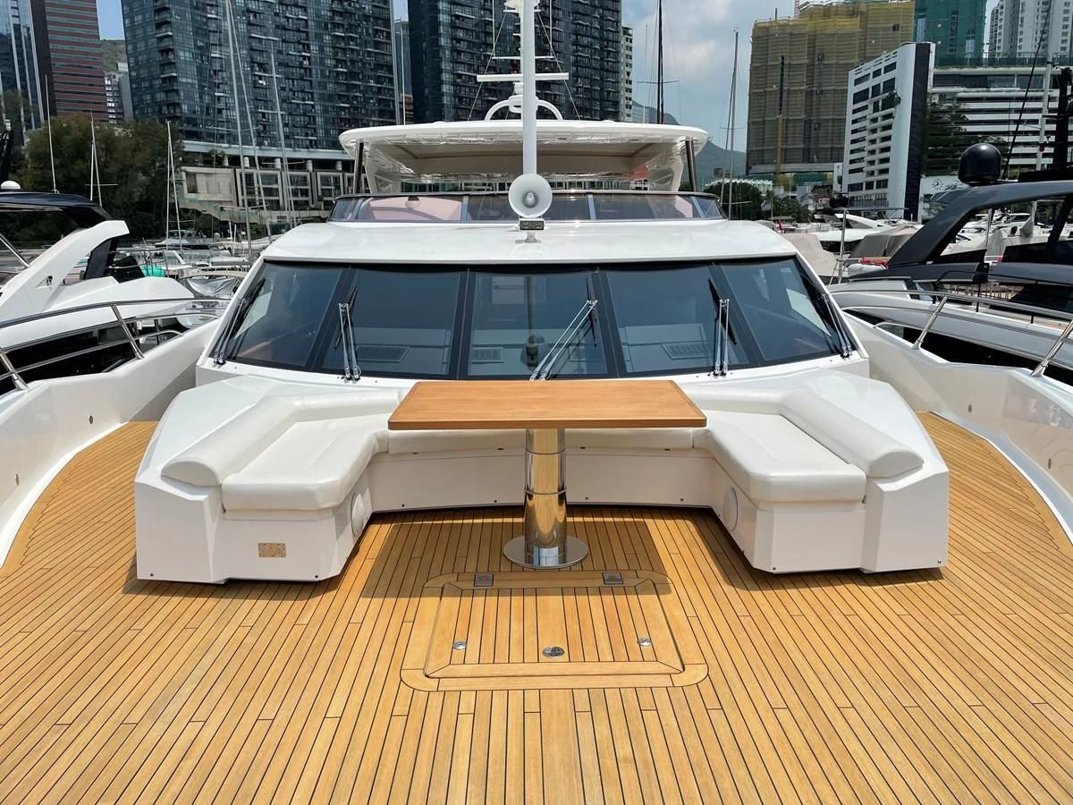 a white car on a wooden surface aboard HARBOUR Yacht for Sale