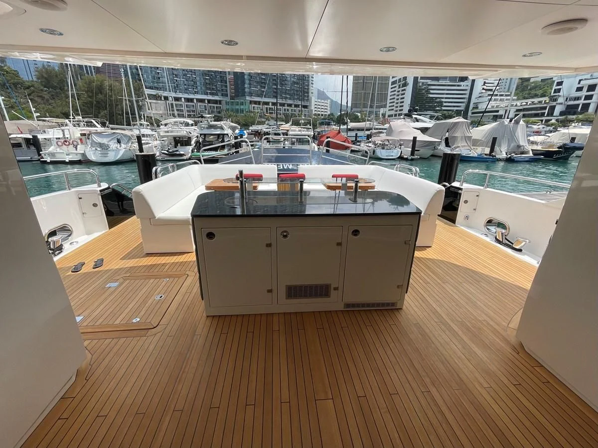 a large room with a table and chairs in it aboard HARBOUR Yacht for Sale