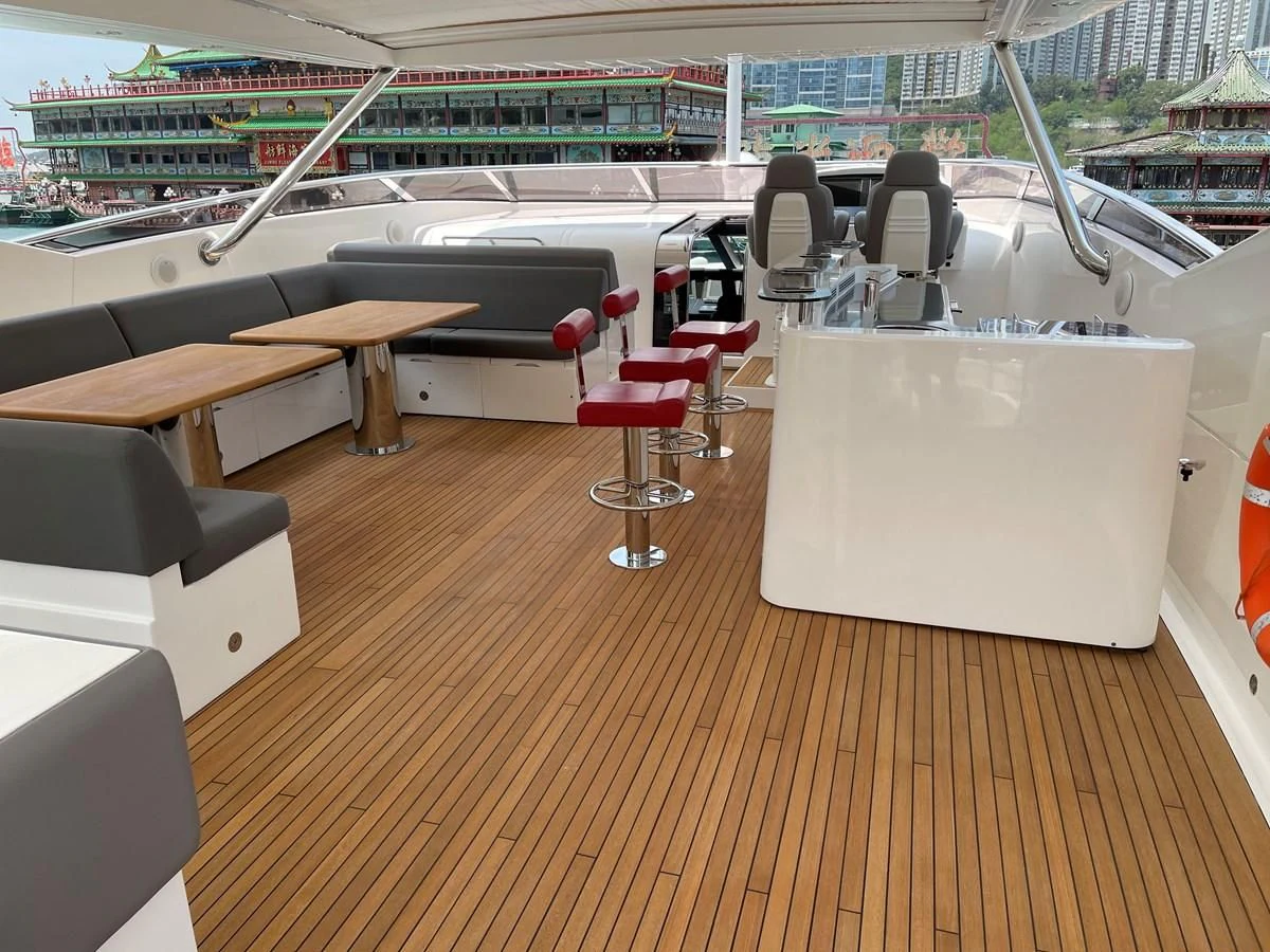 a room with tables and chairs aboard HARBOUR Yacht for Sale