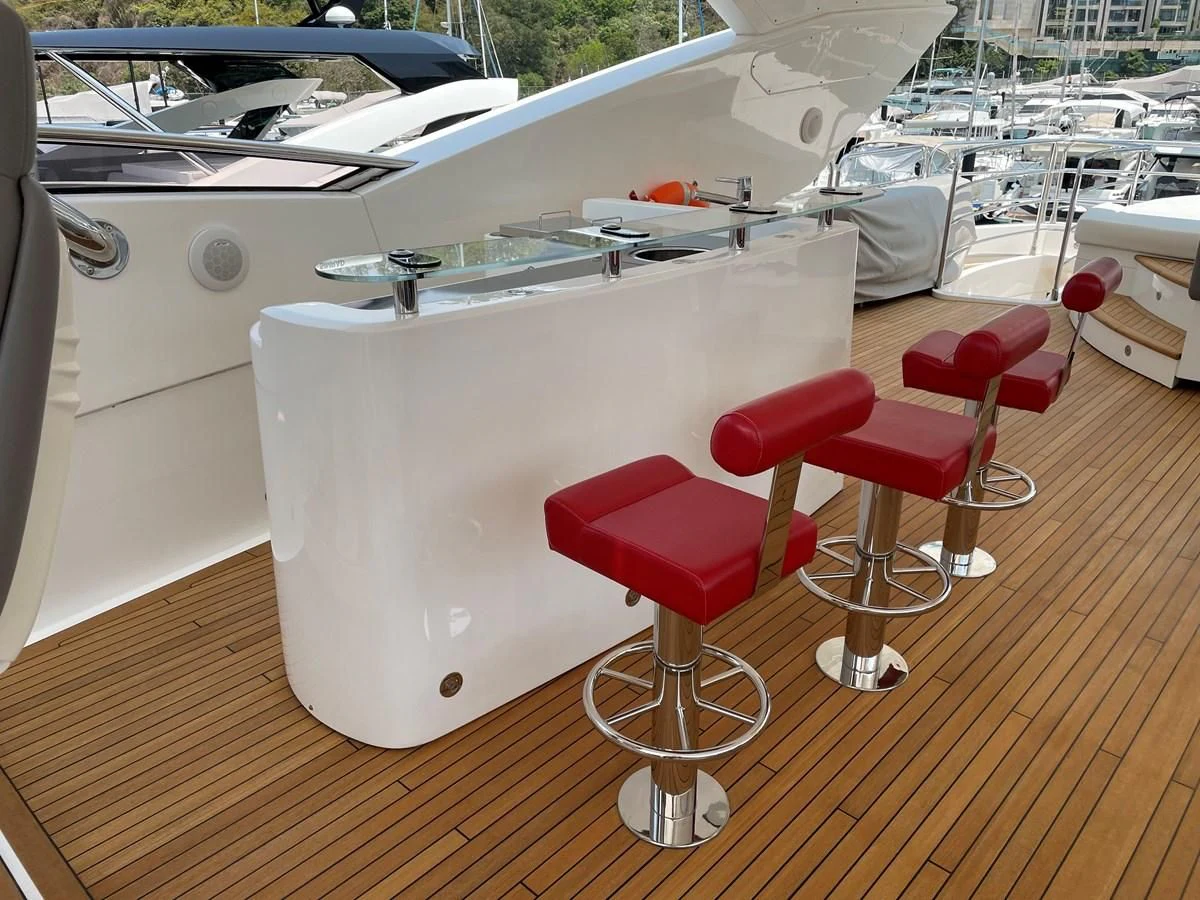 a table with stools on it aboard HARBOUR Yacht for Sale