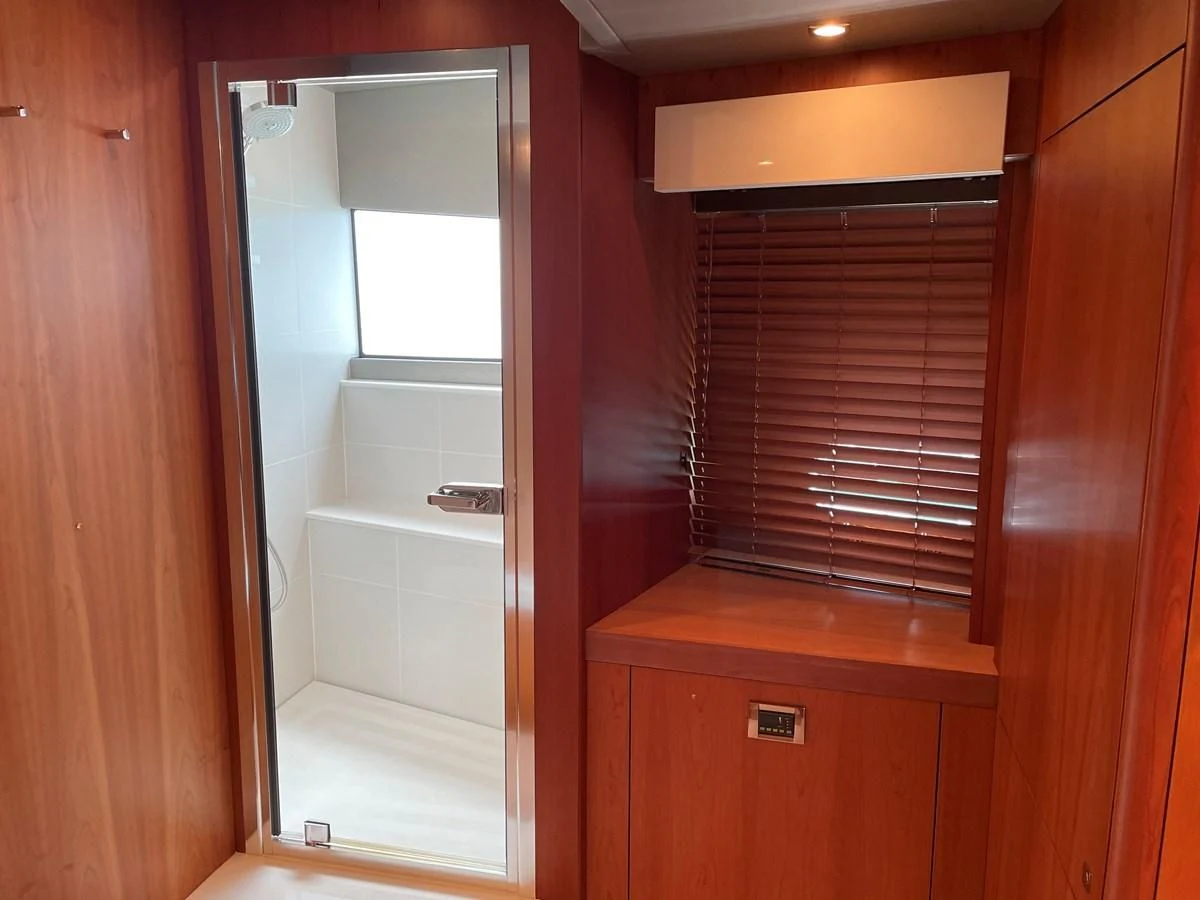 a room with a window and a closet aboard HARBOUR Yacht for Sale