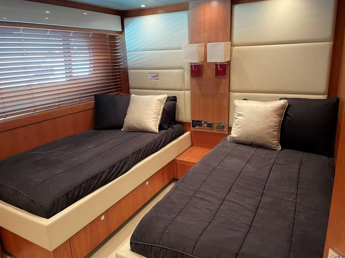 a bed with a couple of pillows aboard HARBOUR Yacht for Sale