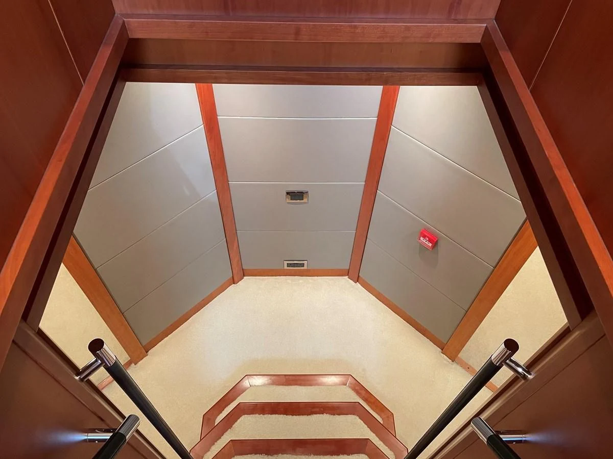 a room with a door and chairs aboard HARBOUR Yacht for Sale