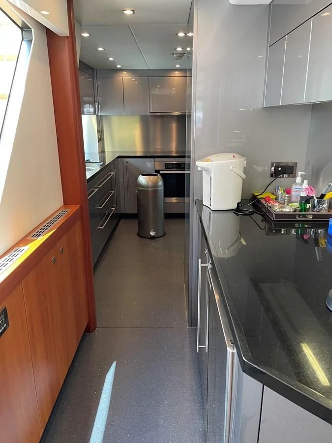 a kitchen with a stainless steel counter aboard HARBOUR Yacht for Sale