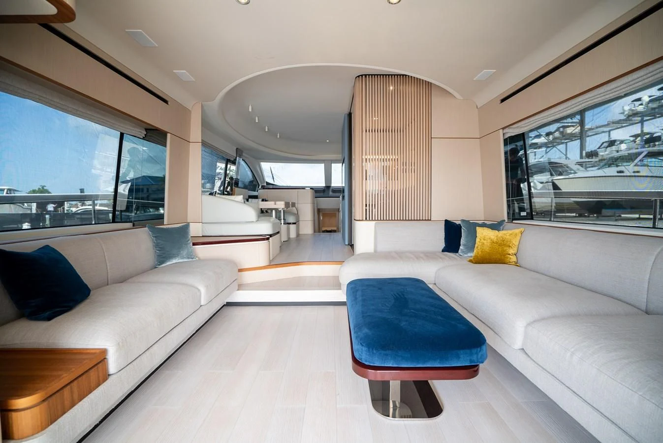 a living room with couches and a window aboard 2023 AZIMUT FLY 78/56 Yacht for Sale