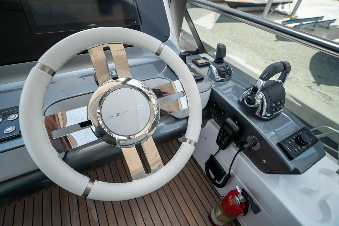 a steering wheel and dashboard of a car aboard 2023 AZIMUT FLY 78/56 Yacht for Sale