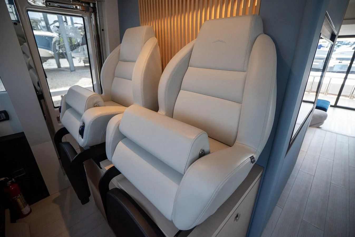 a room with chairs and a table aboard 2023 AZIMUT FLY 78/56 Yacht for Sale