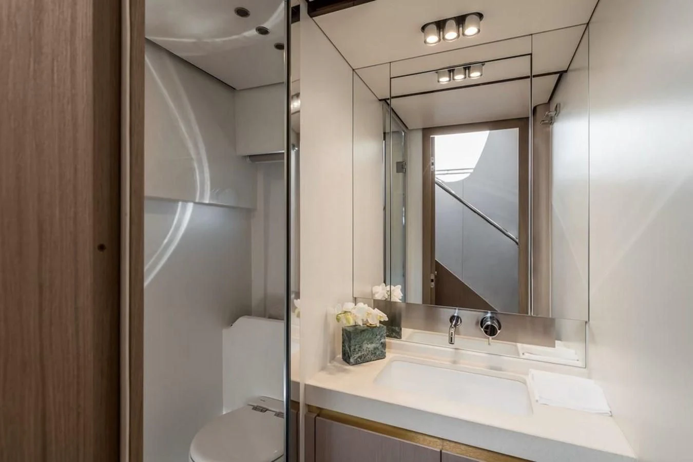 a bathroom with a sink and a mirror aboard 2023 AZIMUT FLY 78/56 Yacht for Sale