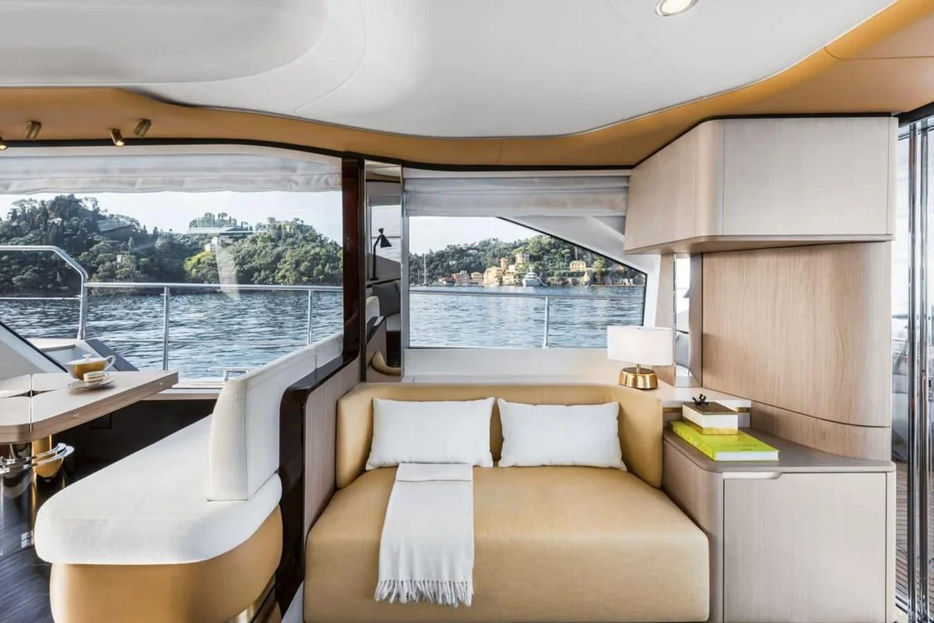 a room with a bed and a table and a window aboard 2023 AZIMUT FLY 78/56 Yacht for Sale