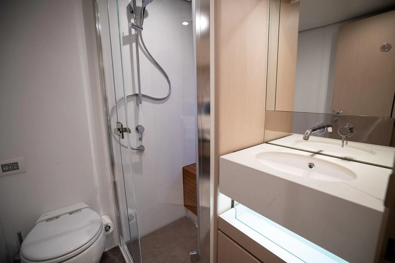 a bathroom with a shower sink and toilet aboard 2023 AZIMUT FLY 78/56 Yacht for Sale