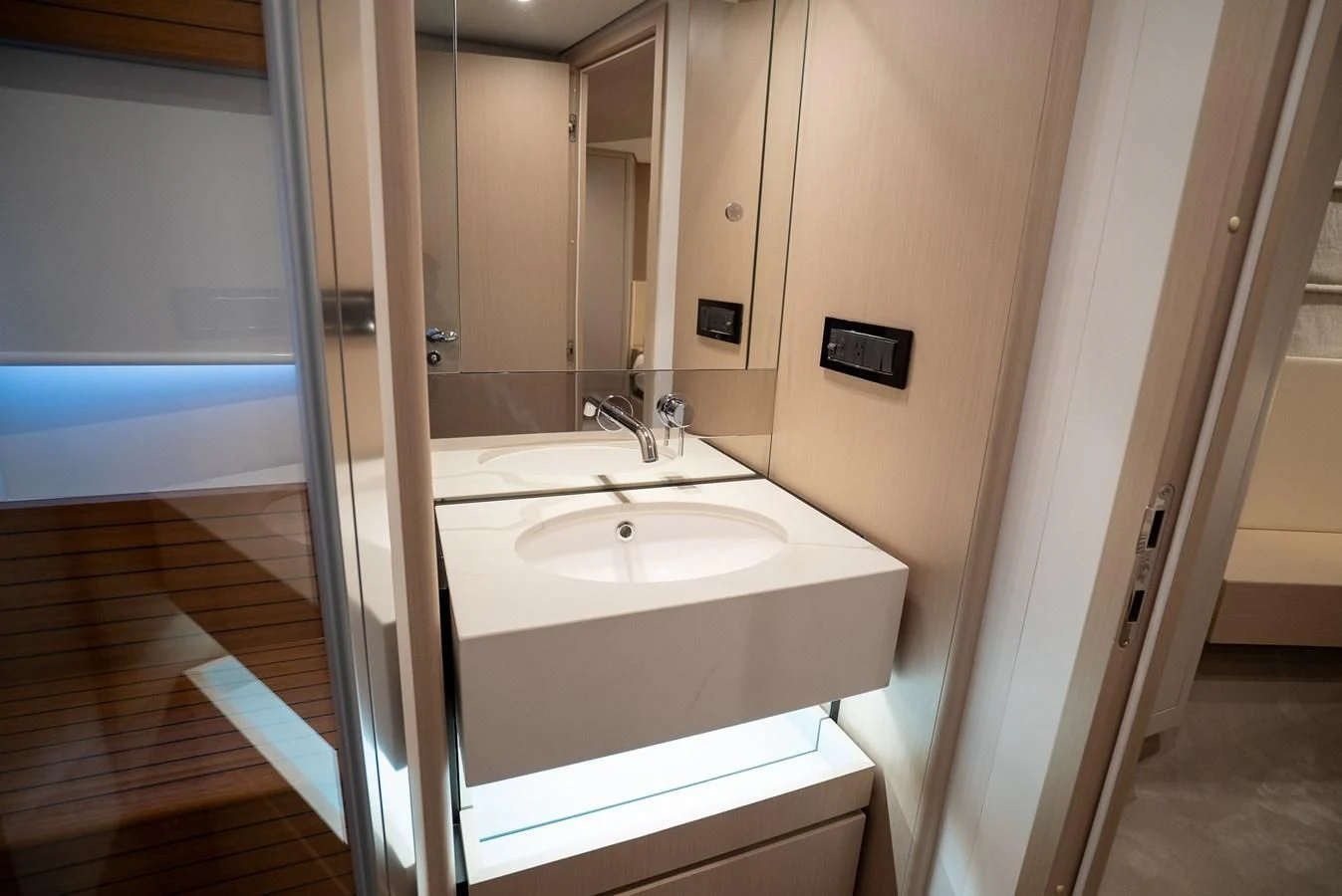 a bathroom with a sink and a mirror aboard 2023 AZIMUT FLY 78/56 Yacht for Sale