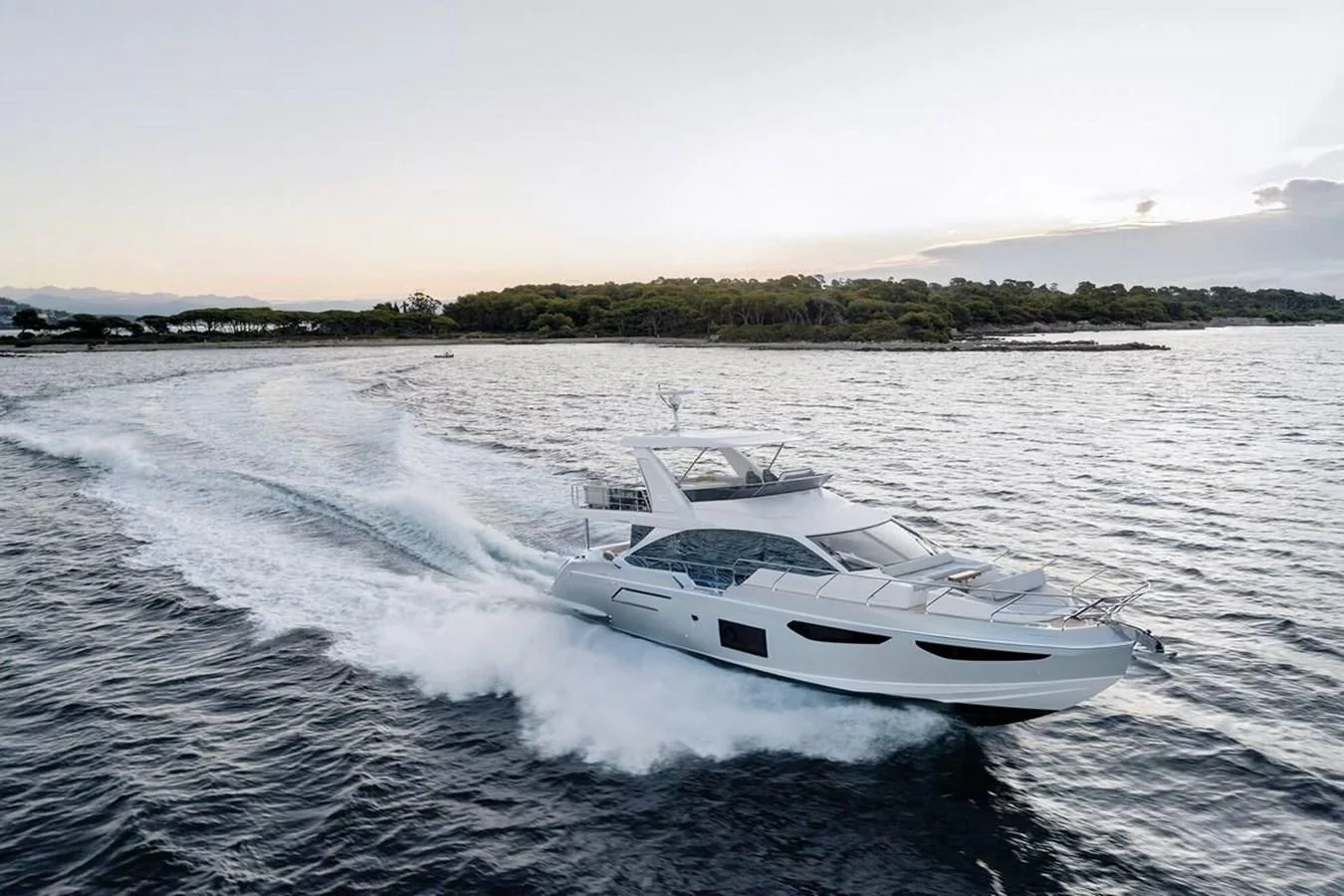 a white yacht on the water aboard 2023 AZIMUT FLY 78/56 Yacht for Sale