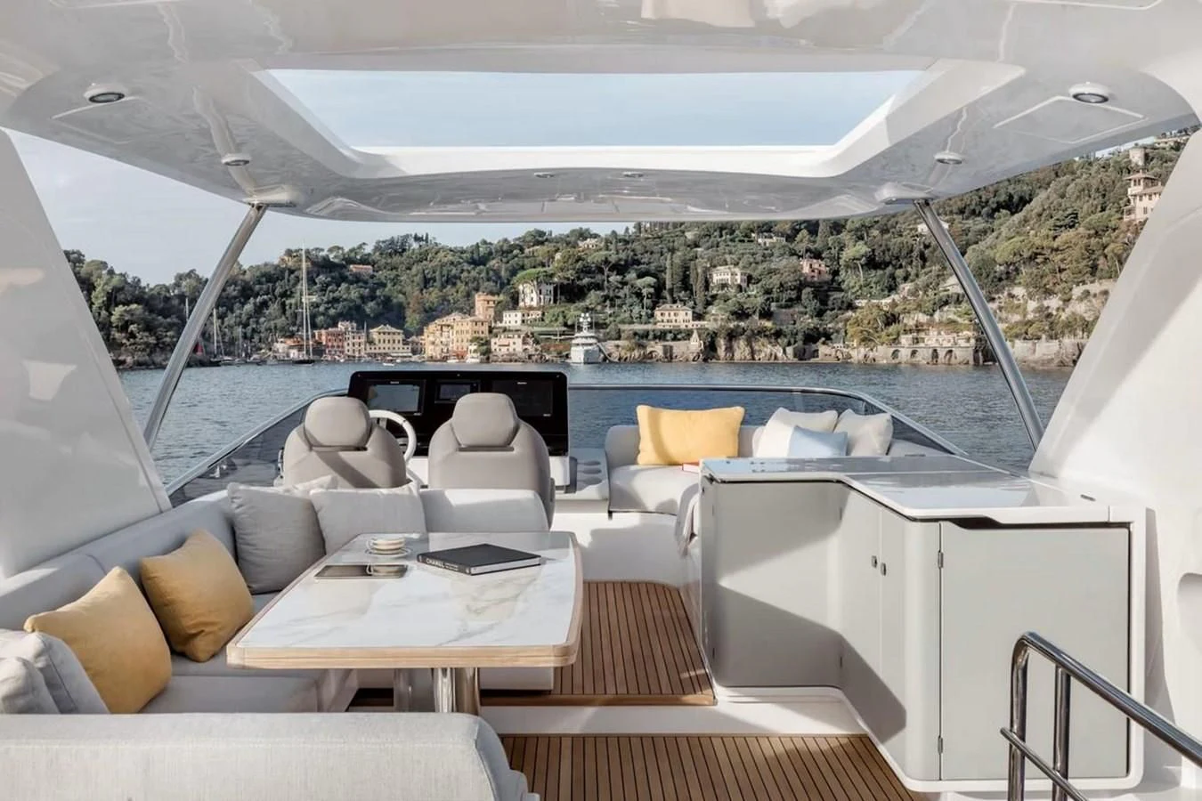 a room with a table and chairs aboard 2023 AZIMUT FLY 78/56 Yacht for Sale