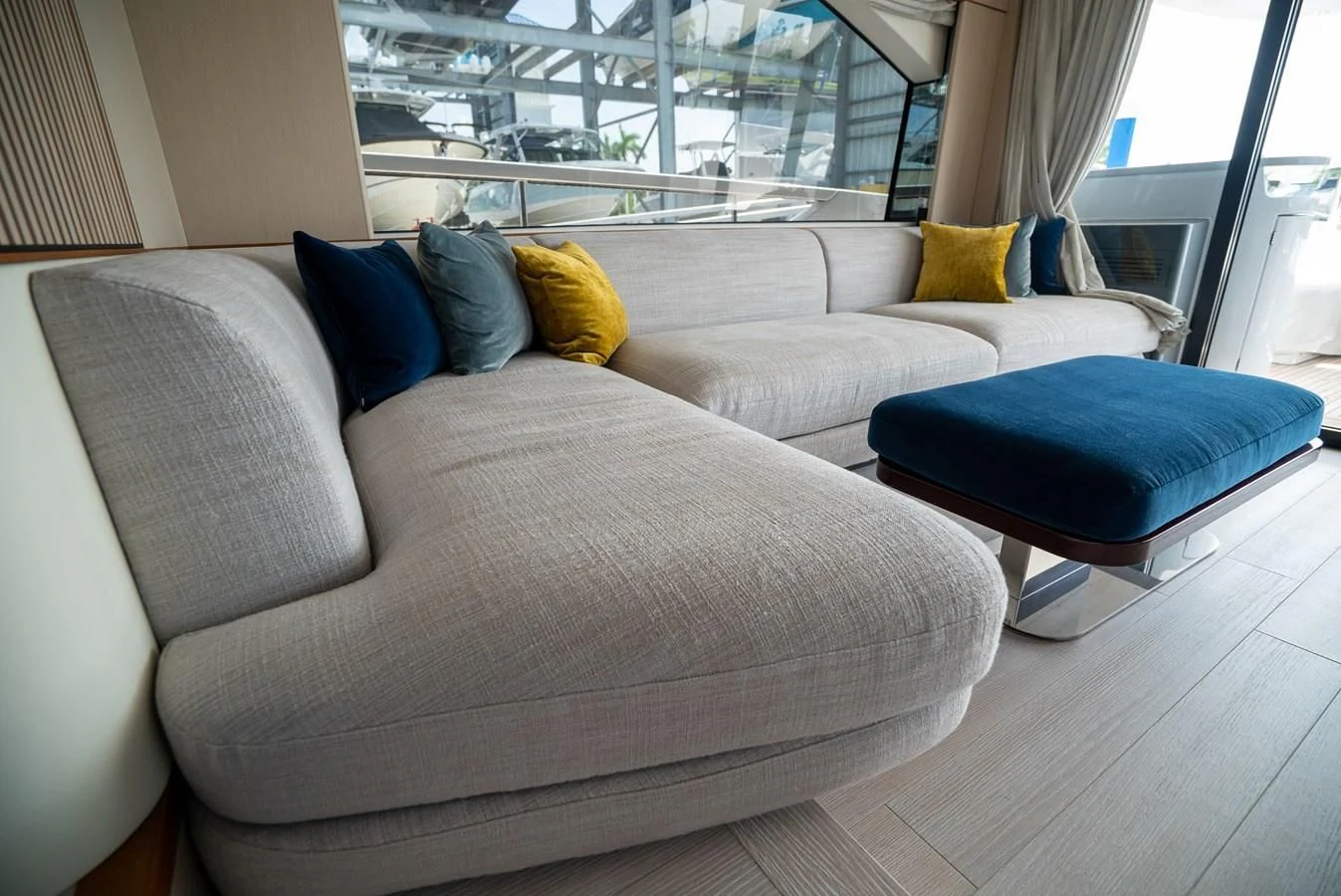 a couch in a room aboard 2023 AZIMUT FLY 78/56 Yacht for Sale