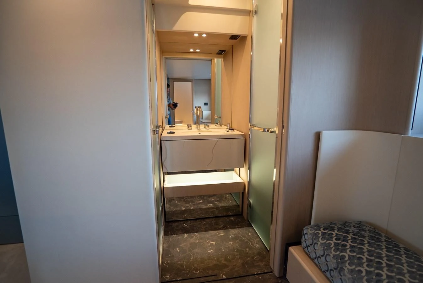 a bathroom with a sink and a mirror aboard 2023 AZIMUT FLY 78/56 Yacht for Sale