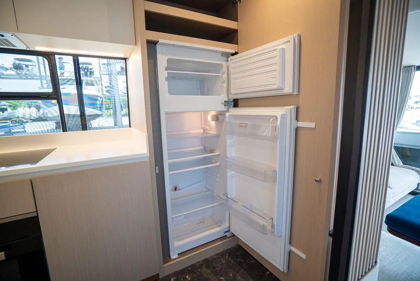 a refrigerator with its doors open aboard 2023 AZIMUT FLY 78/56 Yacht for Sale