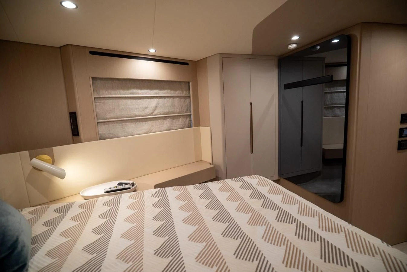 a room with a bed and a phone aboard 2023 AZIMUT FLY 78/56 Yacht for Sale