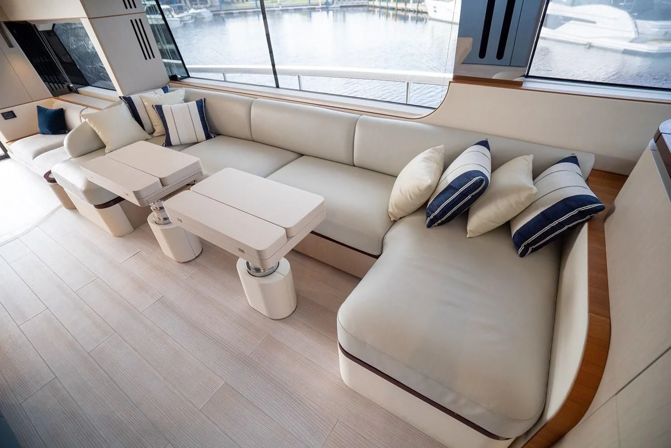 a room with a couch and a table aboard 2023 AZIMUT FLY 78/56 Yacht for Sale