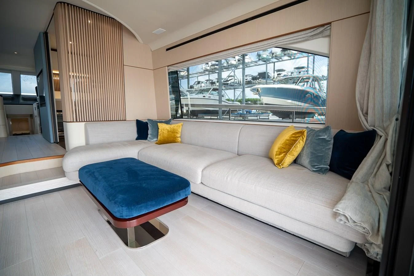 a couch in a room aboard 2023 AZIMUT FLY 78/56 Yacht for Sale
