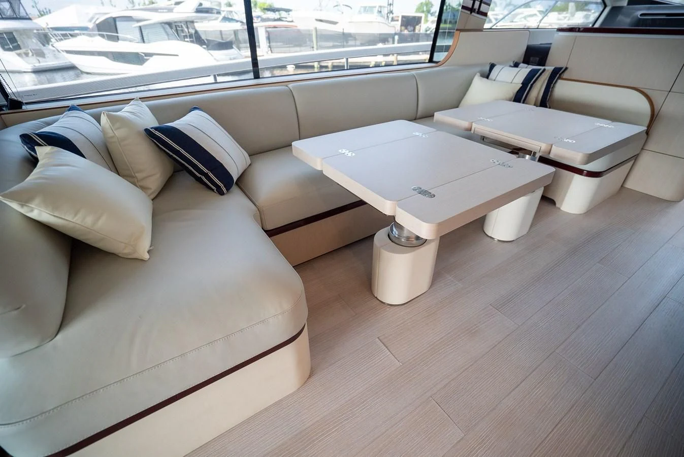 a room with couches and a table aboard 2023 AZIMUT FLY 78/56 Yacht for Sale
