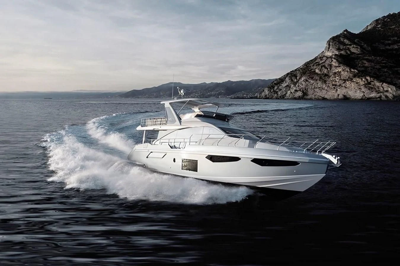 a white yacht on the water aboard 2023 AZIMUT FLY 78/56 Yacht for Sale
