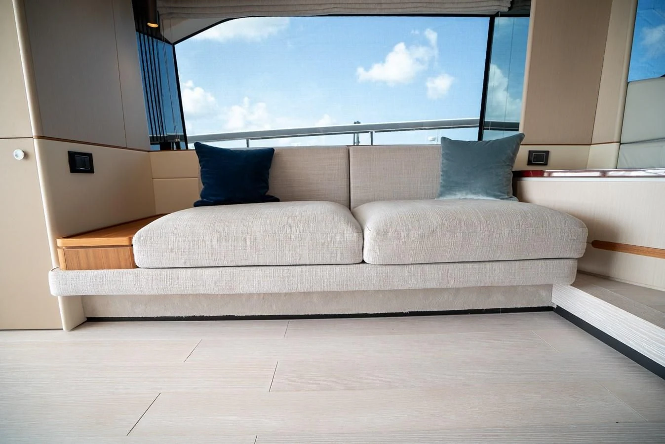 a couch in a room aboard 2023 AZIMUT FLY 78/56 Yacht for Sale