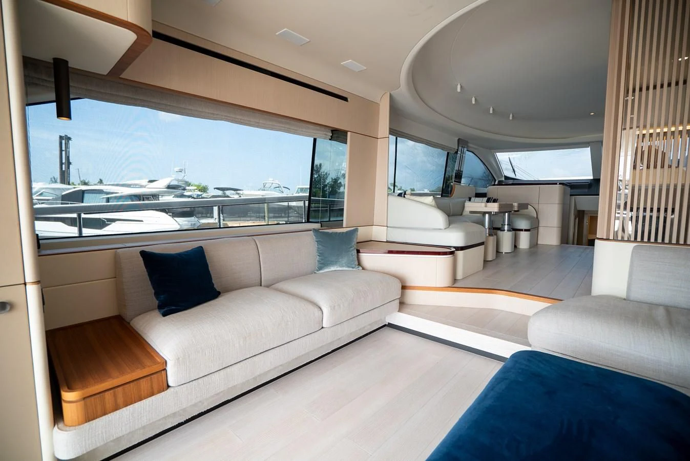 a living room with a large window aboard 2023 AZIMUT FLY 78/56 Yacht for Sale