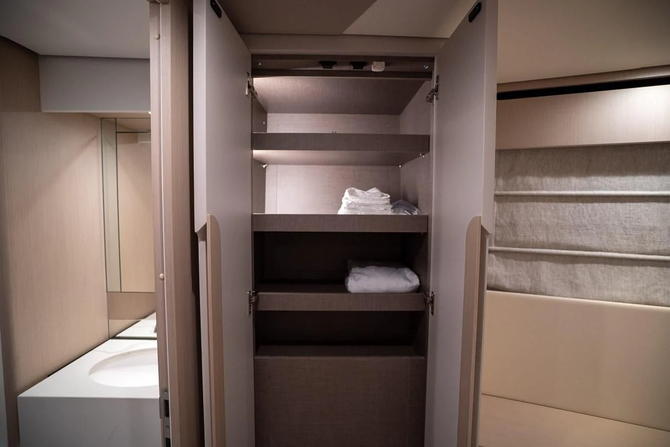 a room with a closet and a bed aboard 2023 AZIMUT FLY 78/56 Yacht for Sale