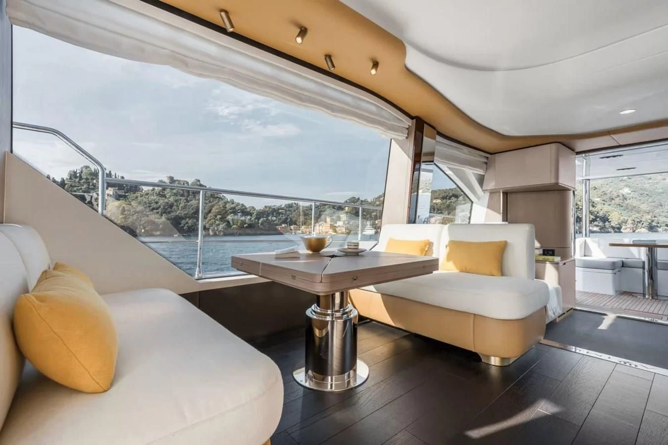a room with a table and chairs aboard 2023 AZIMUT FLY 78/56 Yacht for Sale