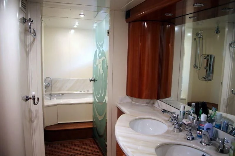 a bathroom with a sink and a bathtub aboard GAMAYUN Yacht for Sale
