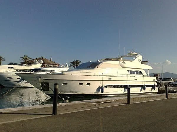 a large white boat in a dock aboard ABOU MAYA Yacht for Sale
