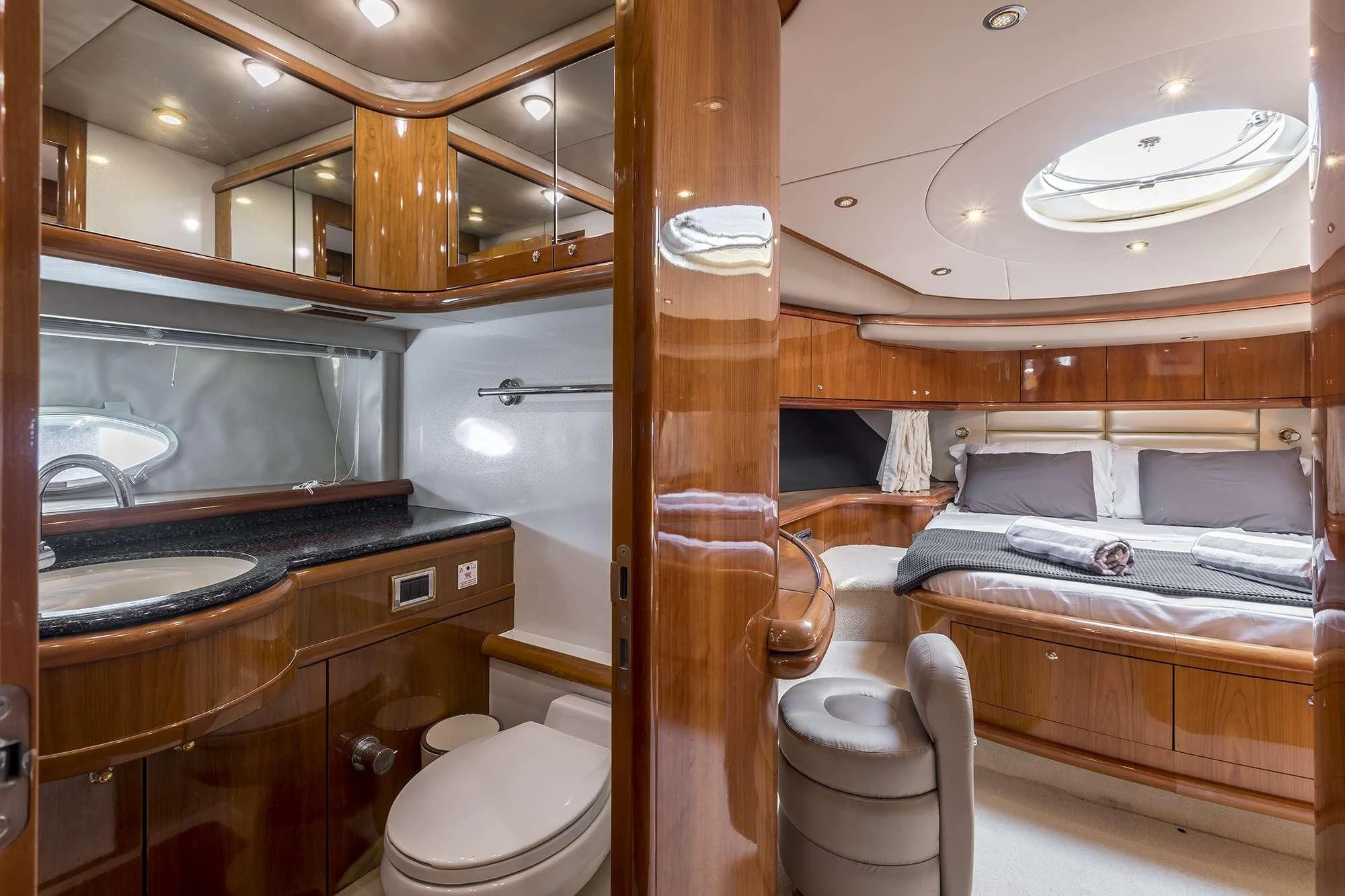 a bathroom with a wood door aboard SKYWATER Yacht for Sale